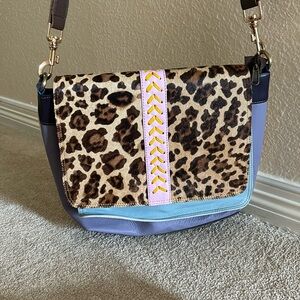 So many great pockets in this crossbody bag. Upcycled leather used once